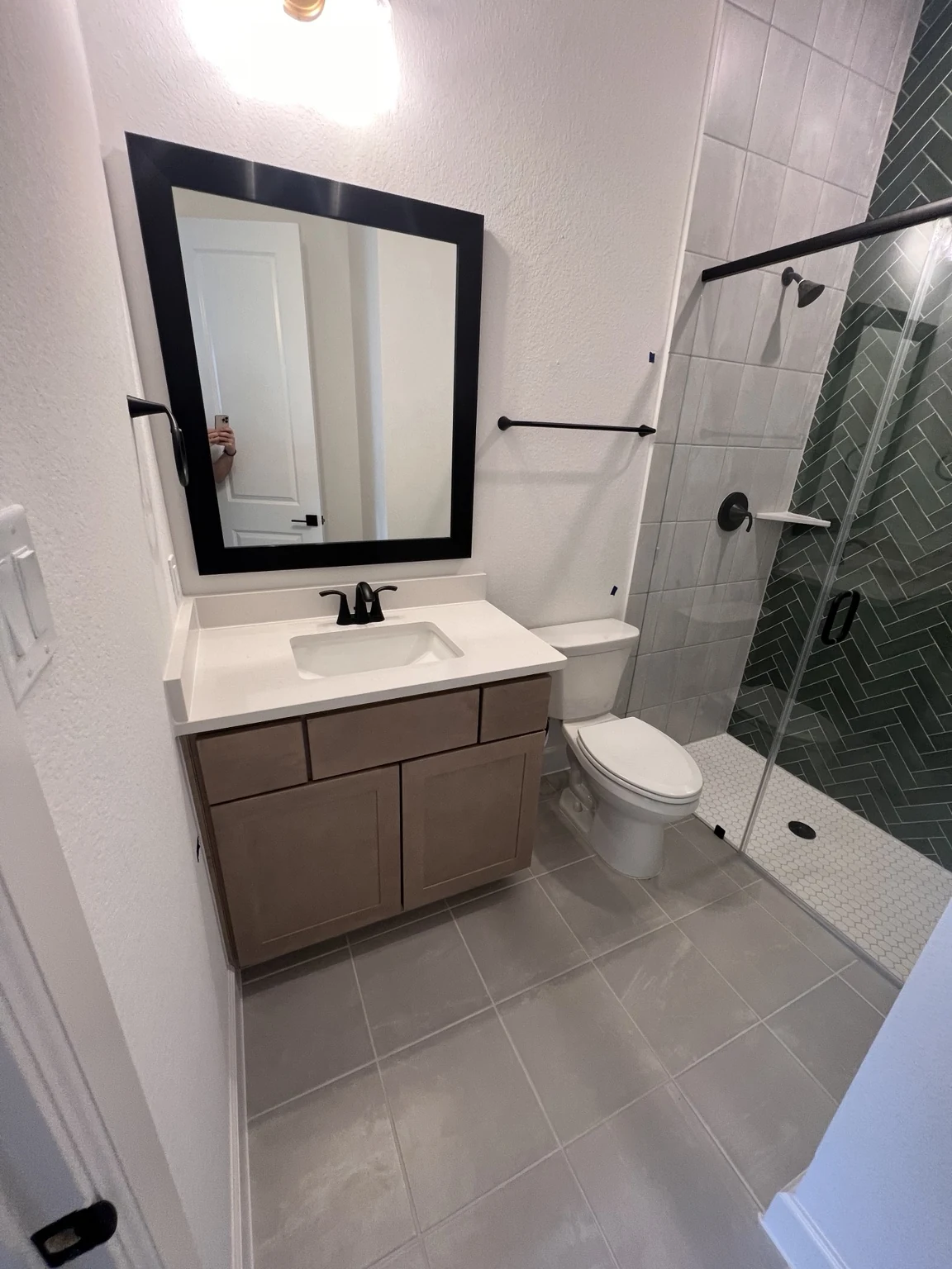 Natural wood vanity with glass shower bathroom project