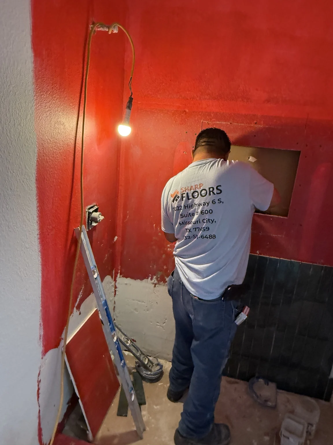 Bathroom shower waterproofing and tile installation in progress by Sharp Floors and Remodeling
