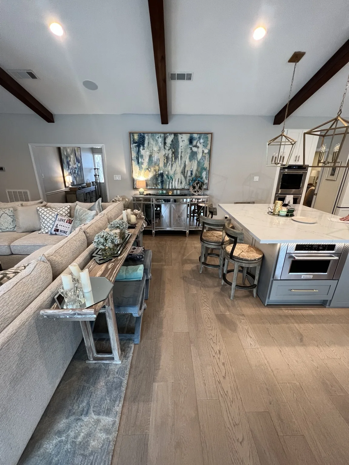 Engineered wood flooring through an open living and kitchen space
