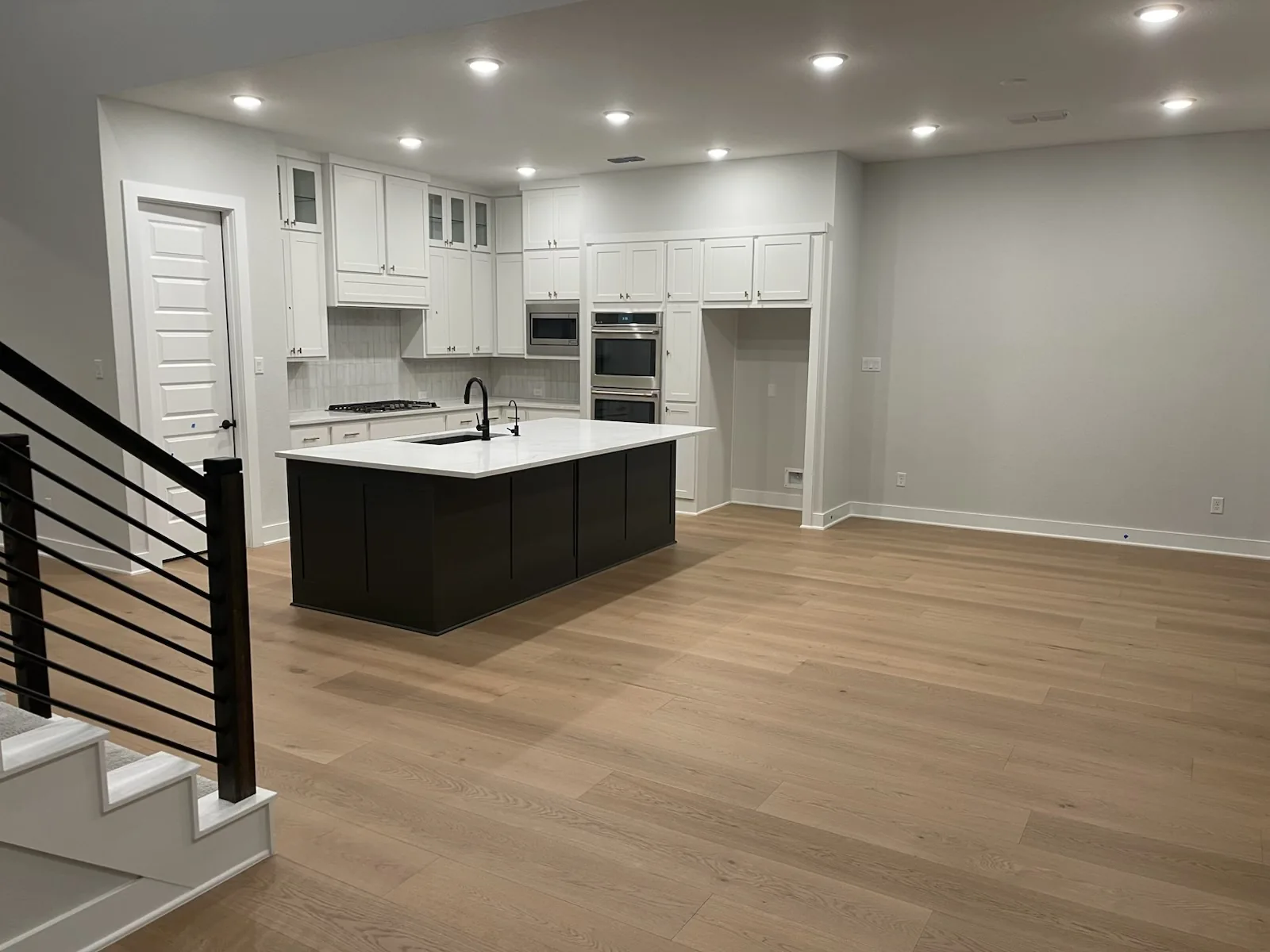 Engineered wood flooring in a modern kitchen and living area