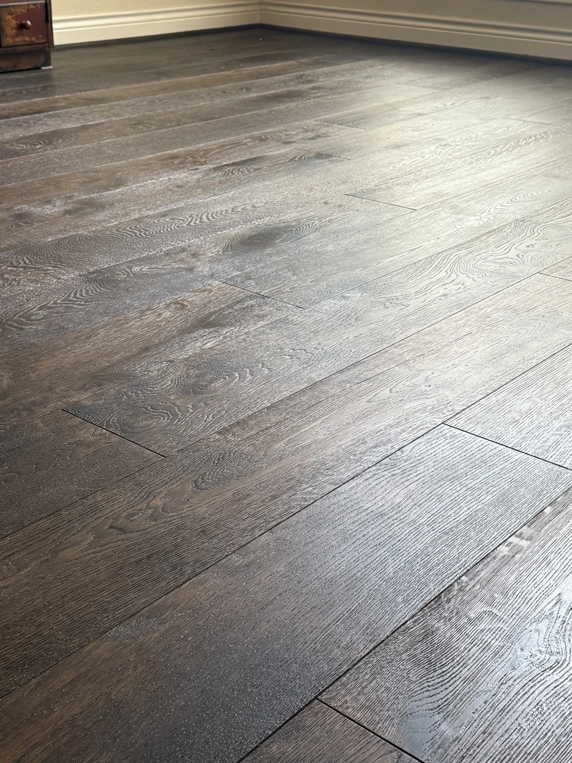 Dark engineered hardwood floor close-up