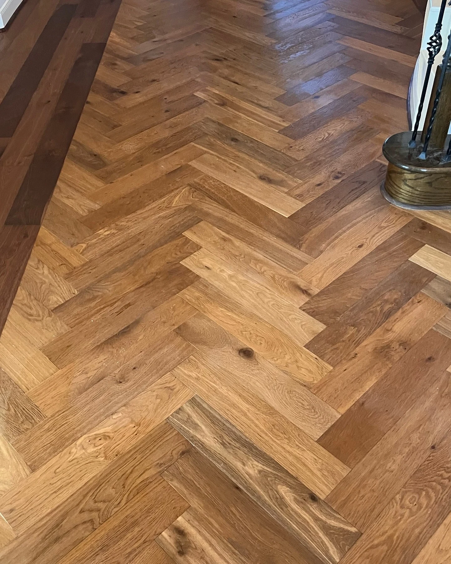 Detailed herringbone hardwood flooring with a contrasting wood border
