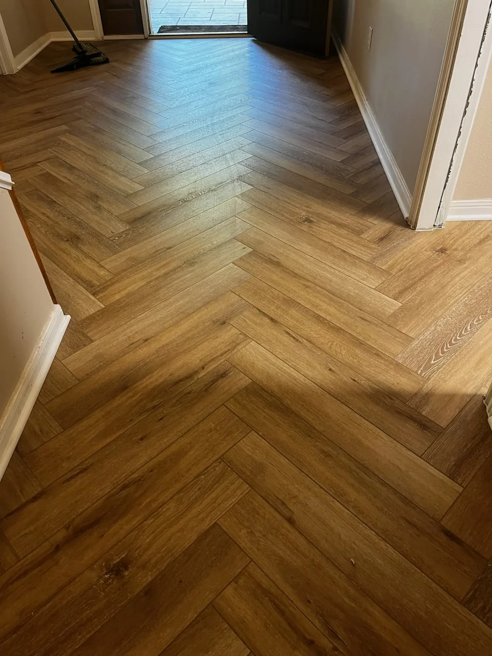 Warm wood-look herringbone tile flooring